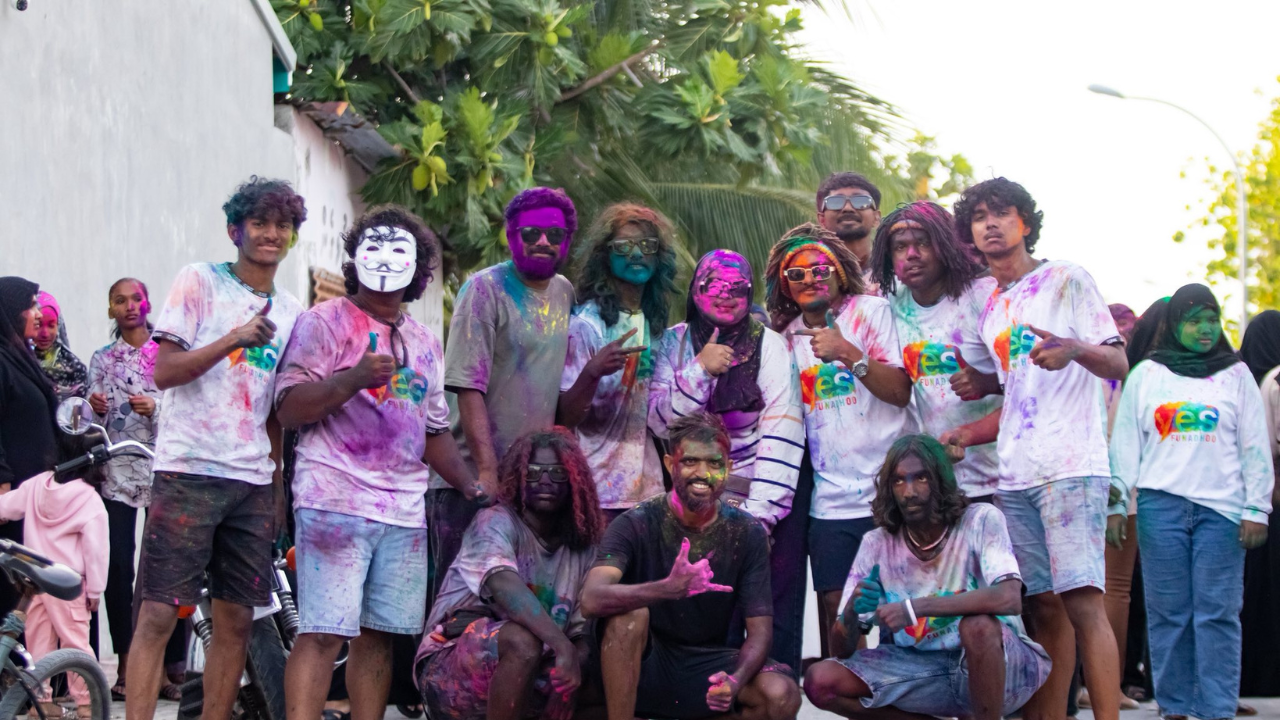 A group of Yes Funadhoo members working together